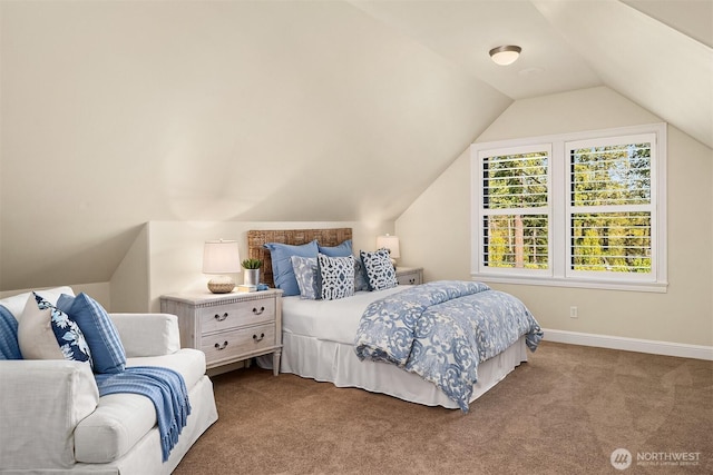 carpeted bedroom with vaulted ceiling and baseboards