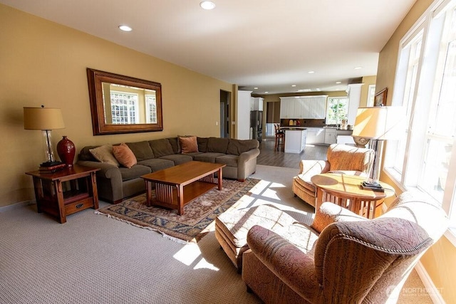 living room featuring recessed lighting and baseboards