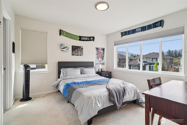 bedroom featuring carpet flooring and baseboards