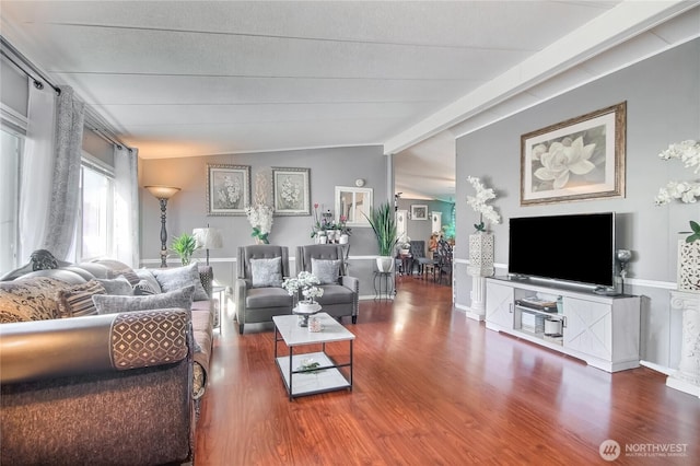 31600 126th Ave SE Unit 114, Auburn, WA 98092 - living room featuring baseboards, wood finished floors, and lofted ceiling with beams