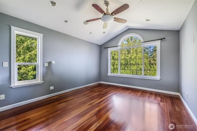 36984 Aspen Way NE, Hansville, WA 98340 - spare room featuring wood finished floors, vaulted ceiling, a ceiling fan, and baseboards
