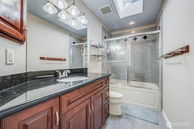 36984 Aspen Way NE, Hansville, WA 98340 - full bath featuring toilet, vanity, shower / bath combination with glass door, a skylight, and recessed lighting
