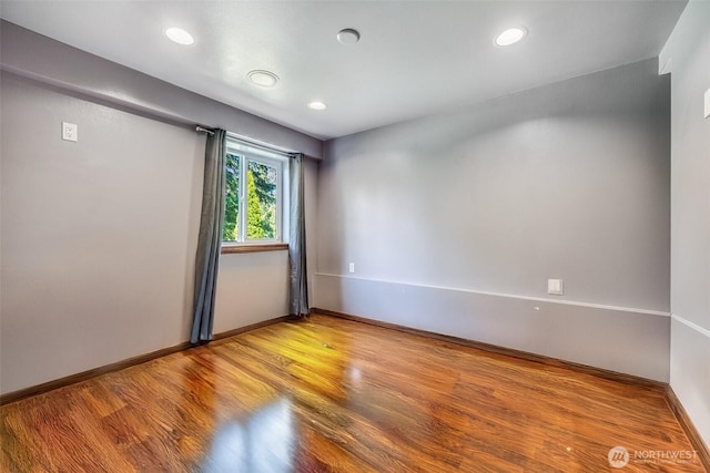 36984 Aspen Way NE, Hansville, WA 98340 - unfurnished room with baseboards, wood finished floors, and recessed lighting