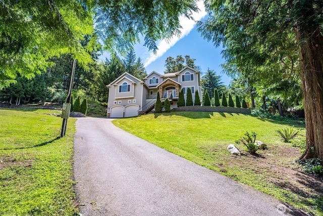36984 Aspen Way NE, Hansville, WA 98340 - traditional-style home featuring an attached garage, driveway, and a front lawn