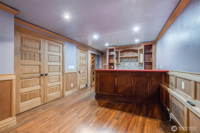 36984 Aspen Way NE, Hansville, WA 98340 - indoor dry bar featuring wood finished floors, wainscoting, recessed lighting, ornamental molding, and tasteful backsplash