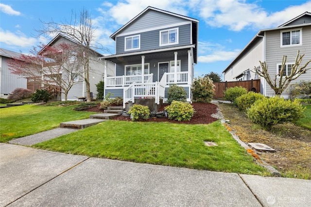 view of front of home with a front lawn and covered porch