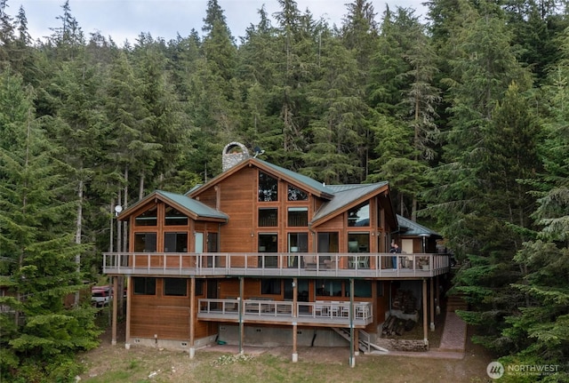 121 Marine Dr, Blakely Island, WA 98222 - back of property with a wooded view and a chimney