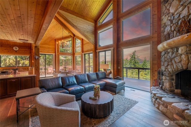 121 Marine Dr, Blakely Island, WA 98222 - living room with wooden ceiling, wood-type flooring, a stone fireplace, and a healthy amount of sunlight