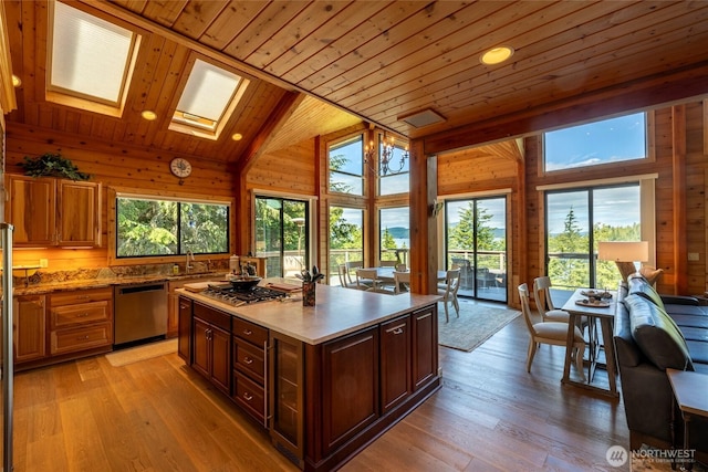 121 Marine Dr, Blakely Island, WA 98222 - kitchen with light wood-type flooring, wooden ceiling, plenty of natural light, and stainless steel appliances