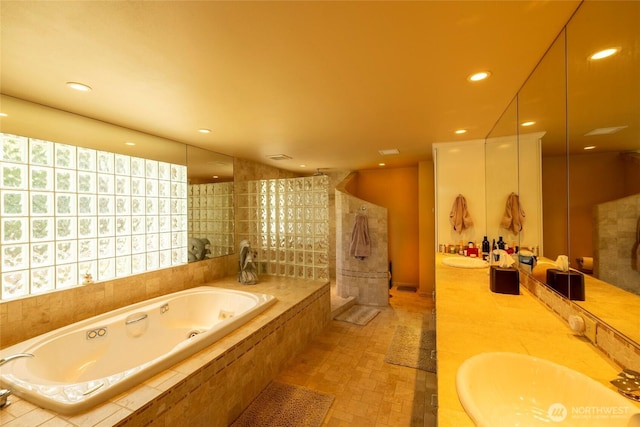 121 Marine Dr, Blakely Island, WA 98222 - bathroom featuring a whirlpool tub, recessed lighting, double vanity, and a sink