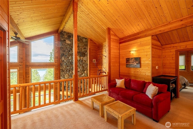 121 Marine Dr, Blakely Island, WA 98222 - living area featuring carpet floors, vaulted ceiling with beams, and a healthy amount of sunlight