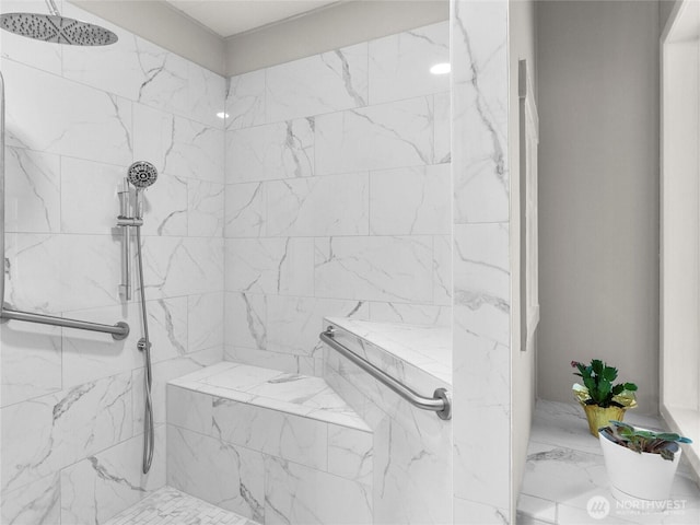 full bathroom with a marble finish shower