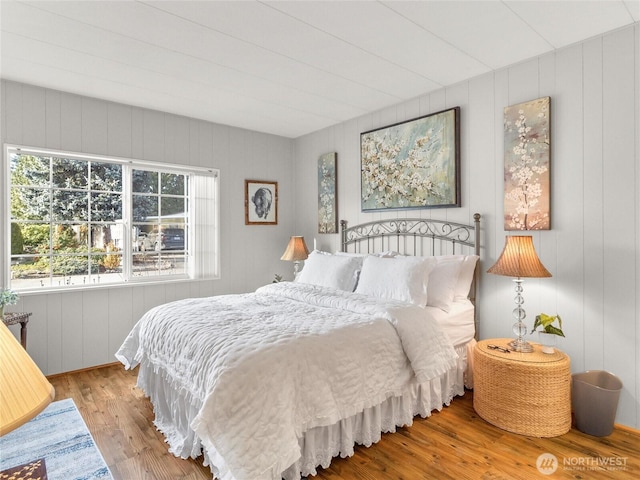 bedroom with wood finished floors