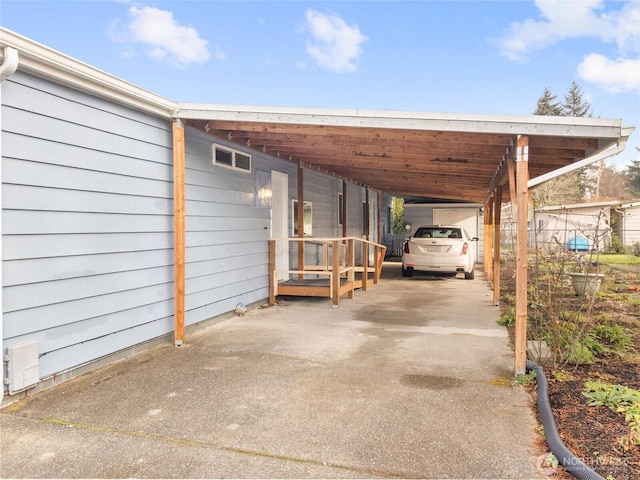 view of parking featuring aphalt driveway and an attached carport