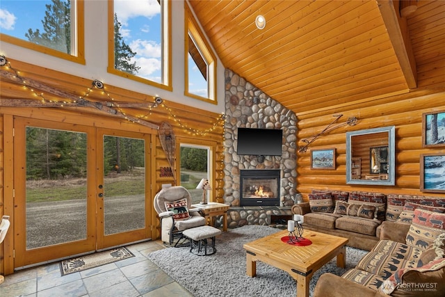 living room with high vaulted ceiling, plenty of natural light, wood ceiling, and stone tile flooring