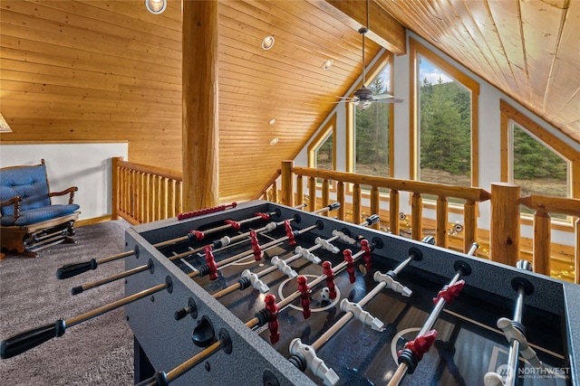 playroom with ceiling fan, vaulted ceiling, wooden ceiling, carpet flooring, and wooden walls