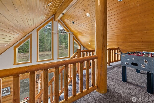 game room with wood ceiling, ceiling fan, lofted ceiling with beams, and carpet floors