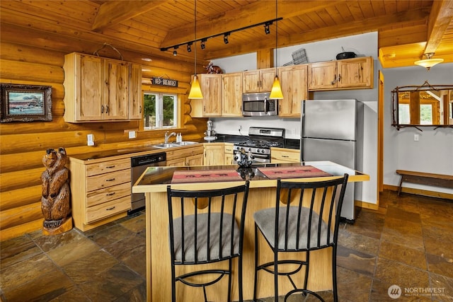 kitchen with beamed ceiling, wooden ceiling, a sink, stainless steel appliances, and stone tile flooring
