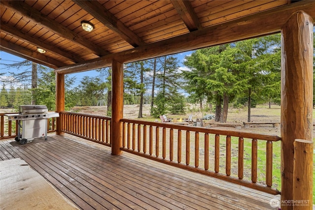 wooden terrace featuring a grill