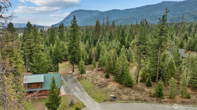 exterior space featuring a view of trees