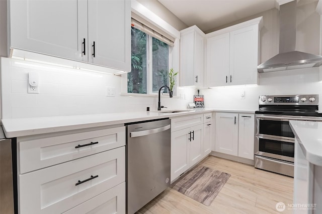 6321 Pony Pl, Maple Falls, WA 98266 - kitchen featuring stainless steel appliances, light countertops, wall chimney exhaust hood, and a sink