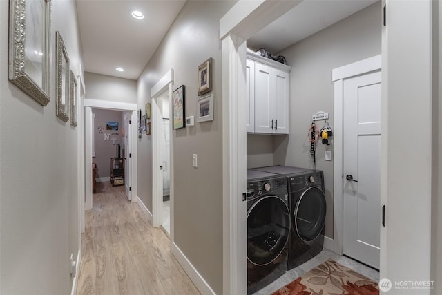 6321 Pony Pl, Maple Falls, WA 98266 - washroom with baseboards, light wood-style floors, recessed lighting, cabinet space, and washing machine and clothes dryer