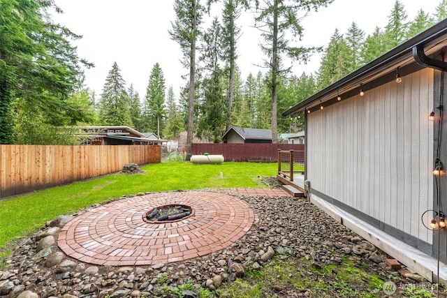6321 Pony Pl, Maple Falls, WA 98266 - view of yard featuring a patio, a fenced backyard, and an outdoor fire pit