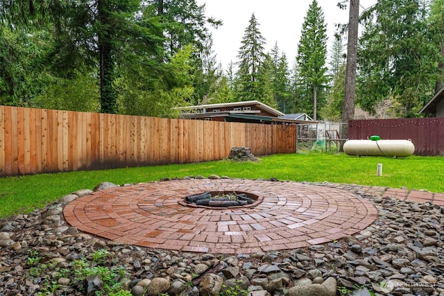6321 Pony Pl, Maple Falls, WA 98266 - view of yard with a fenced backyard, an outdoor fire pit, and a patio