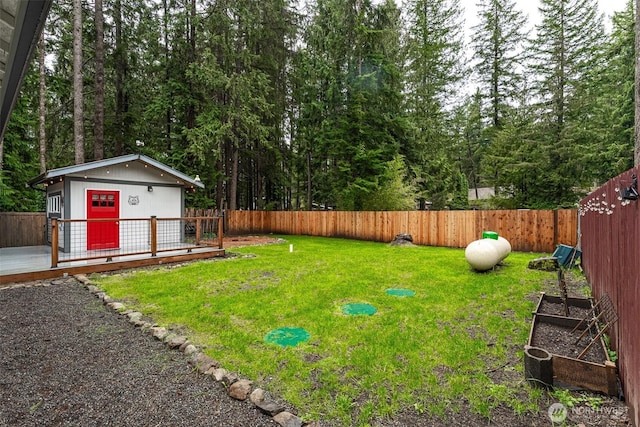 6321 Pony Pl, Maple Falls, WA 98266 - view of yard with a garden, an outbuilding, a fenced backyard, and a deck