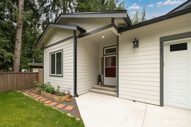 6321 Pony Pl, Maple Falls, WA 98266 - property entrance featuring fence, a lawn, and a garage