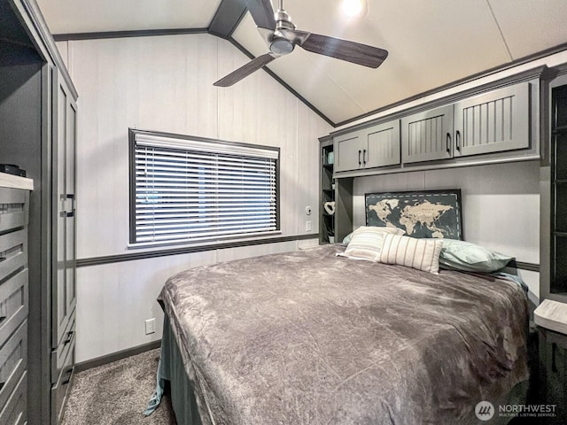 bedroom featuring a ceiling fan, dark colored carpet, and lofted ceiling