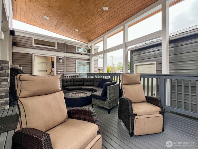 interior space with an outdoor living space with a fire pit