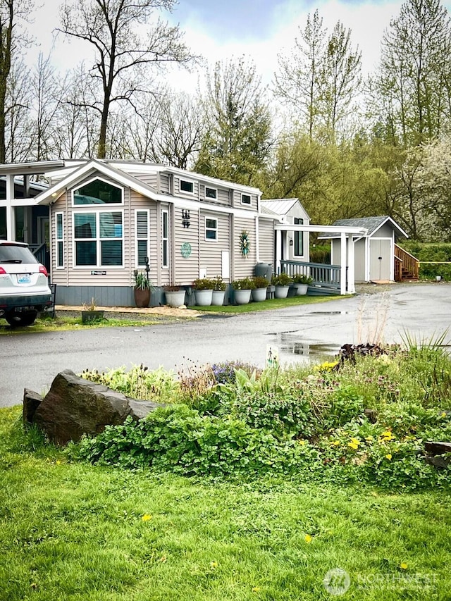 view of front of house with an outbuilding