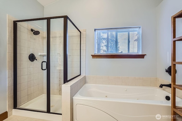 bathroom with a shower stall and a whirlpool tub