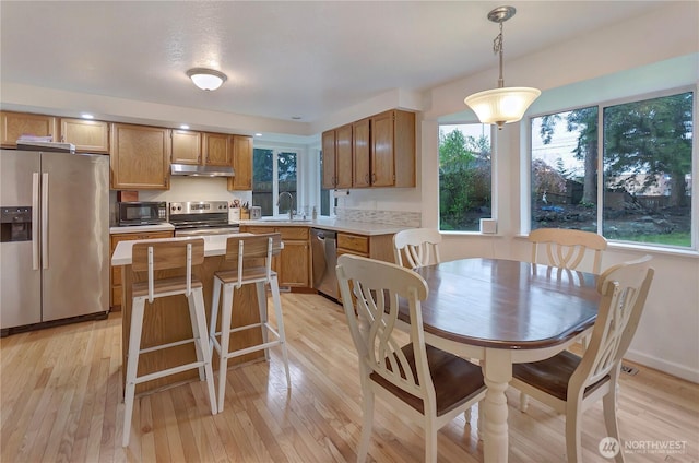 9410 175th Street Ct E, Puyallup, WA 98375 - dining area featuring light wood-type flooring