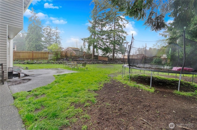 9410 175th Street Ct E, Puyallup, WA 98375 - view of yard with a trampoline, a patio, and a fenced backyard