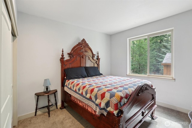bedroom featuring baseboards and carpet flooring