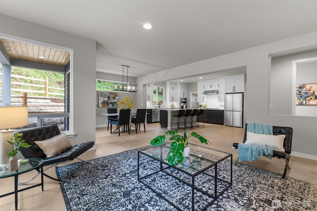 18122 83rd Ave NE, Kenmore, WA 98028 - living area with light wood-style flooring, baseboards, and recessed lighting