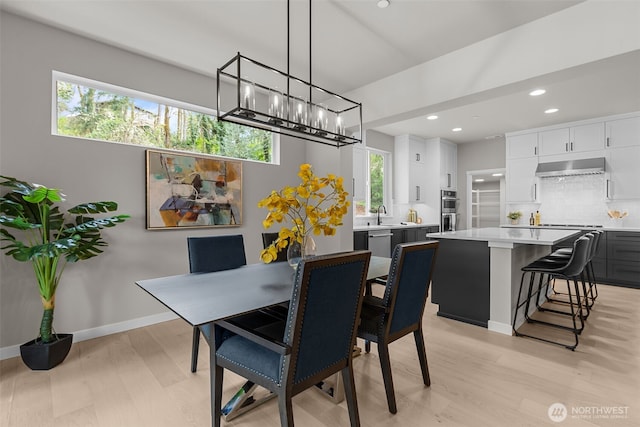 18122 83rd Ave NE, Kenmore, WA 98028 - dining room with light wood finished floors, a notable chandelier, baseboards, and recessed lighting