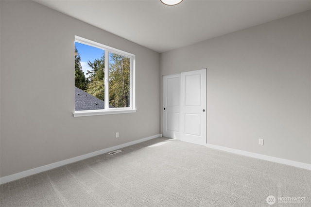 18122 83rd Ave NE, Kenmore, WA 98028 - unfurnished room with visible vents, baseboards, and carpet flooring
