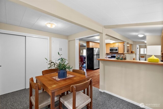 view of carpeted dining space