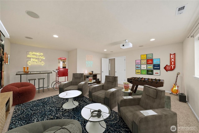 carpeted living room with baseboards, visible vents, and recessed lighting