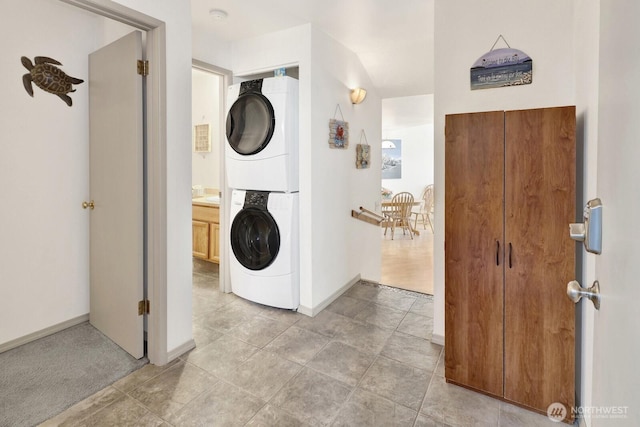 7806 Birch Bay Dr Unit 1107, Blaine, WA 98230 - clothes washing area featuring stacked washer and dryer, baseboards, and laundry area