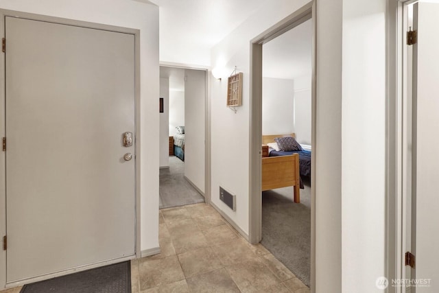 7806 Birch Bay Dr Unit 1107, Blaine, WA 98230 - corridor featuring visible vents, light colored carpet, and baseboards