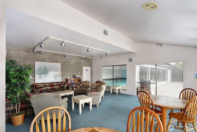 7806 Birch Bay Dr Unit 1107, Blaine, WA 98230 - dining area with carpet floors, rail lighting, vaulted ceiling, and visible vents