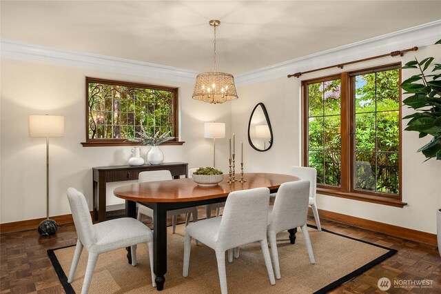 1919 Shenandoah Dr E, Seattle, WA 98112 - dining area featuring baseboards, a chandelier, crown molding, and healthy amount of natural light