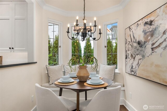 1919 Shenandoah Dr E, Seattle, WA 98112 - dining space featuring a chandelier, ornamental molding, and baseboards