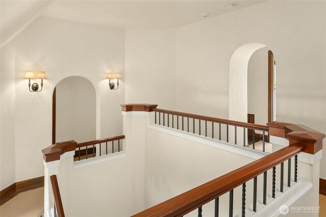 1919 Shenandoah Dr E, Seattle, WA 98112 - hall featuring arched walkways, an upstairs landing, and lofted ceiling