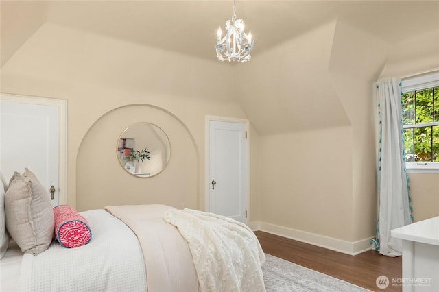 1919 Shenandoah Dr E, Seattle, WA 98112 - bedroom featuring wood finished floors, baseboards, lofted ceiling, and a chandelier