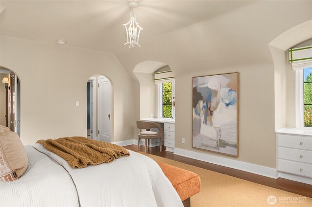 1919 Shenandoah Dr E, Seattle, WA 98112 - bedroom featuring arched walkways, multiple windows, baseboards, and vaulted ceiling